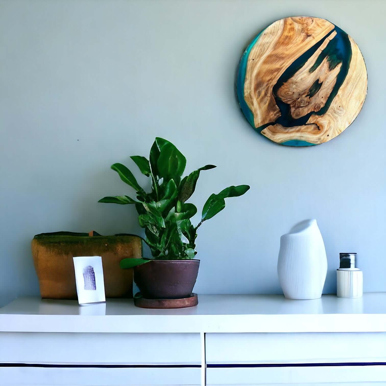 Round Epoxy Resin Art Wall Decor Above Modern White Cabinet